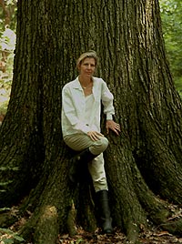image, Joan Maloof next to old growth tree.